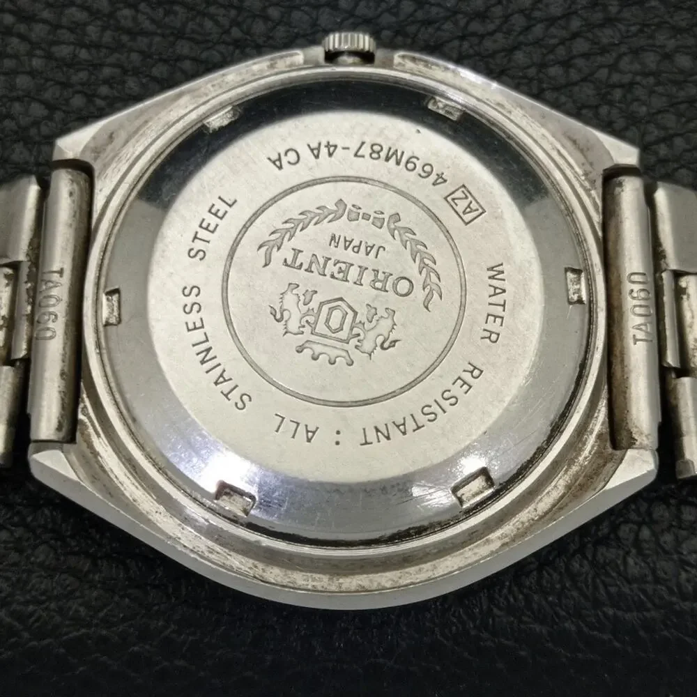 Vintage 1976 Orient Automatic Mens Silver Watch W/daydate & Gold accents